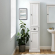 Seaside Tall Linen Cabinet in Distressed White Finish