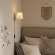 Sunlit Swivel Wall Sconce in Natural Finish Wood, White Metal & Fabric