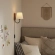 Sunlit Swivel Wall Sconce in Walnut Finish Wood, Black Metal & White Fabric