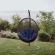 Encase Swing Outdoor Lounge Chair in Poly Rattan with Navy Cushion