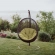 Encase Swing Outdoor Lounge Chair in Poly Rattan with Peridot Cushion