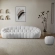 Nest Curved Sofa in All Over Tufted White Boucle Fabric